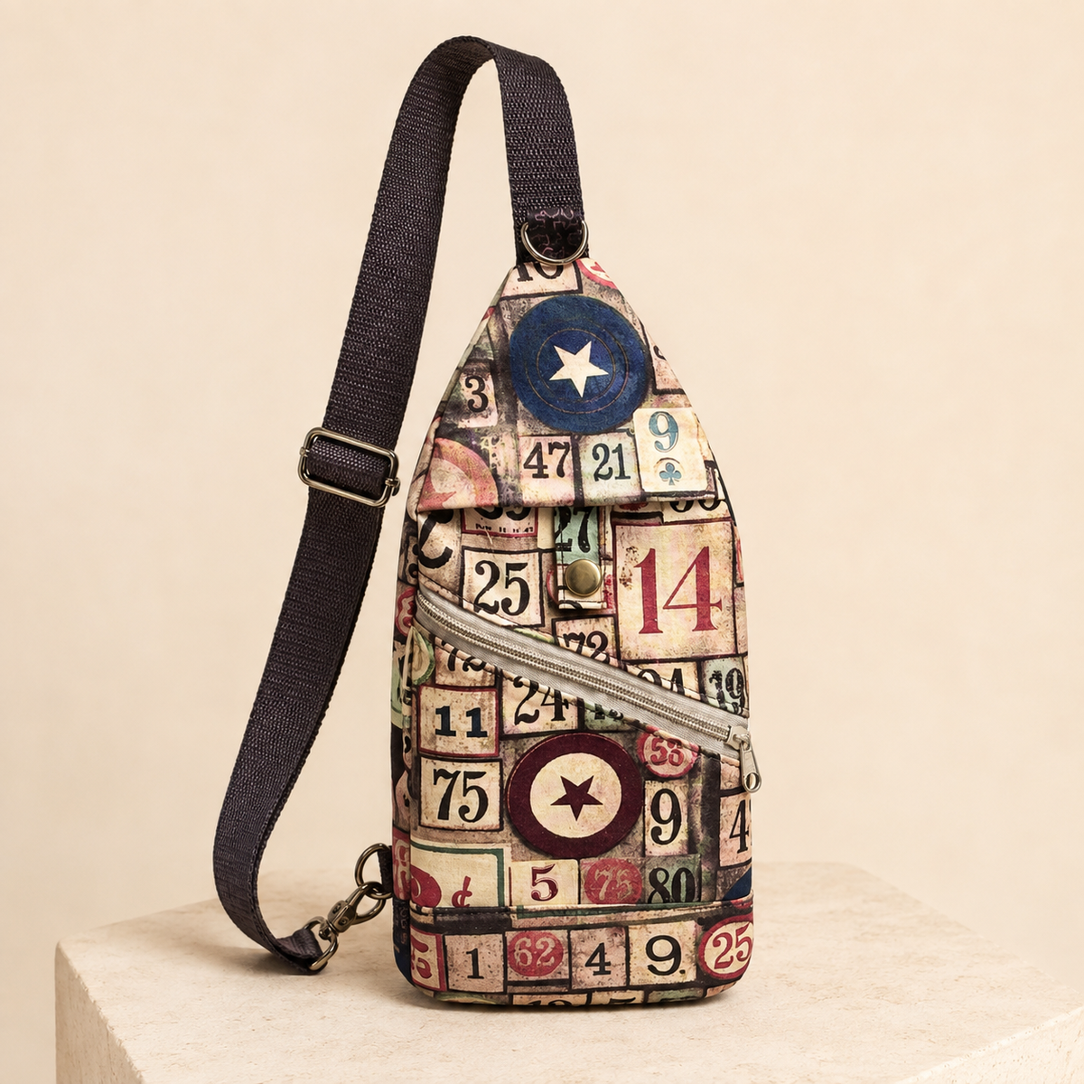 Handmade bingo-print sling bag with adjustable black strap